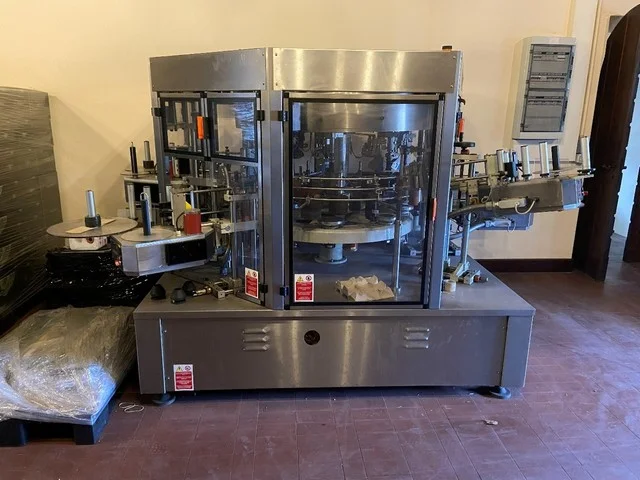 Used Sacmi adhesive labeller — 2
