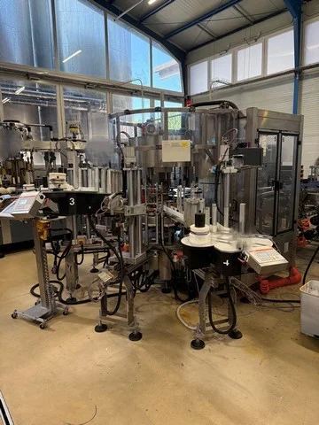 Used Kosme labeller with 4 adhesive stations with electronic cam