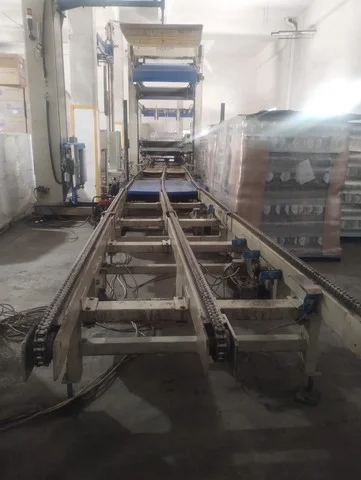 Used Sacmi palletizer with semi-automatic pallet wrapper