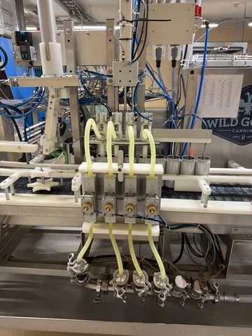 Used Wild Goose gravity canning line for beer