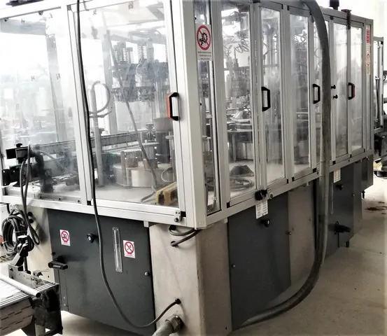 Capsuladora Robino & Galandrino Capsuler Robino&Galandri Usada — linha de engarrafamento usada para Capsuling Machines